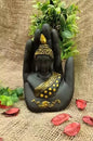 Black-Golden Handcrafted Meditating Palm Buddha Idol